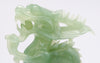 A superb carved green jade Dragon with loose carved ball in its mouth