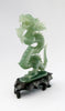A superb carved green jade Dragon with loose carved ball in its mouth