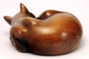 Carved wood cat, curled up sleeping