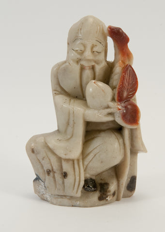 small carved soapstone wiseman holding peach staff 030