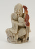 small carved soapstone wiseman holding peach staff 030
