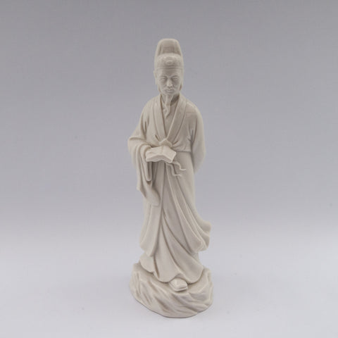 white porcelain figurine blanc de chine man book