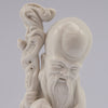 white porcelain figurine blanc de chine wiseman staff peach