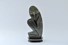 abstract crouching person carving