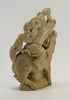 carved soapstone man sitting on dragon 010