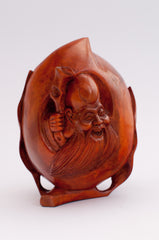 carved wood apple sized wiseman holding staff