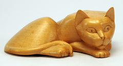 Carved wood cat, laying flat