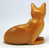 Carved wood cat, alert and noticed something