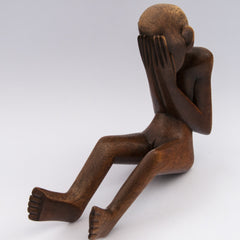 carved wood lady naked sitting sorrow