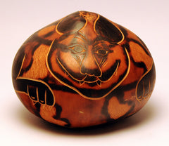 Carved nut cat, curled into ball