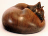 Carved wood cat, curled up sleeping