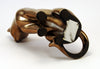 Content looking cat in a light brassy finish