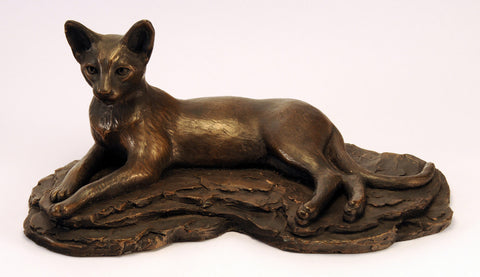 Bronze cat figurine, laying long, ears pricked alert
