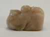 small carved soapstone wiseman hugging peach 010