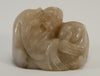 small carved soapstone wiseman hugging peach 010