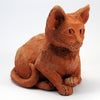 Terracotta textured clay cat ornament, contently sitting pose.